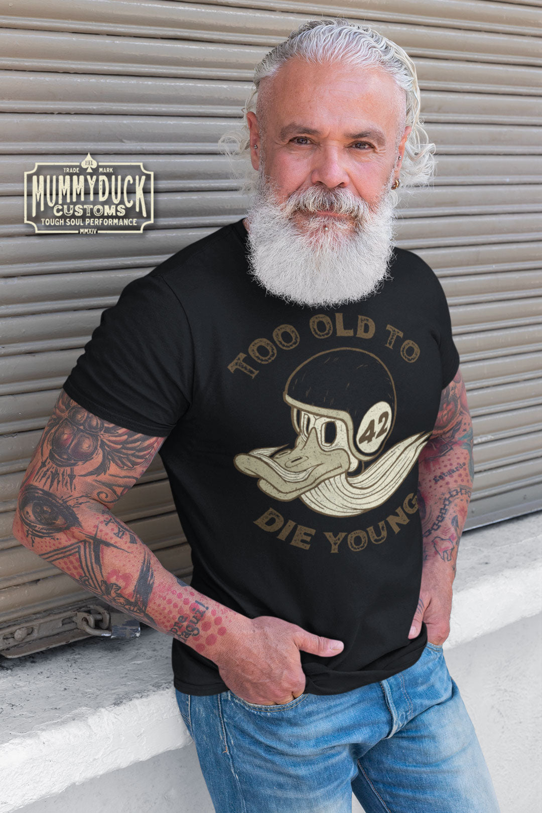 the "Too Old To Die Young" Motorcycle T-Shirt by Mummyduck Customs – a true testament to style, comfort, and the spirit of the open road. If you're a motorcycle enthusiast or simply appreciate distinctive fashion, you've just uncovered the quintessential addition to your wardrobe.